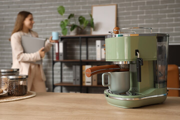 Wall Mural - Coffee machine on counter in office, closeup