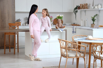 Sticker - Happy mother with her little daughter in kitchen