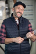 © auremar - portrait of a middle-aged tradesman holding a clipboard