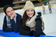 © auremar - beautiful young couple ice skating on rink outdoors