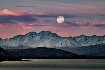 gorgeous moutain view at sunset with moon in the sky