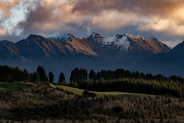 magnificant snow mountains in morning sunlight with fog