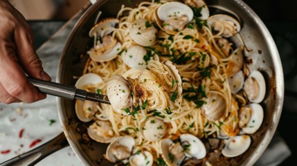 A chef masterfully tosses spaghetti with clams in a skillet, creating a flavorful dish with a touch of fresh herbs, showcasing culinary expertise and Italian tradition.