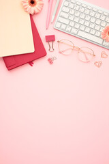 Wall Mural - Chic workspace with trendy accessories on pink backdrop. Perfect for articles or ads related to office work, fashion blogging, or creative industries. Ideal for adding a stylish touch to your content