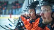 © master1305 - Focused hockey players in orange jersey and helmet intently watching game from the bench. Tension and anticipation of the match.