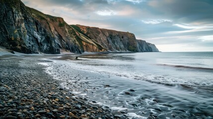 Wall Mural - Rocky beach with dramatic cliffs and ocean views