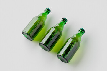 Canvas Print - Green steinie beer bottle mockup on a grey background.