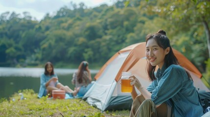 Sticker - Amid the lush greenery of a lake forest, happy Asian young women friends enjoy a summer camping trip, drinking tea and cherishing their time together in the natural park.