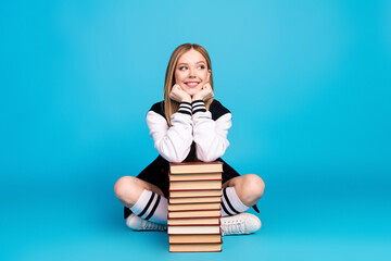 Sticker - Photo of cute dreamy pretty cheerful girl wear trendy clothes long socks look empty space isolated on blue color background