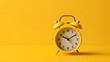 © matpit73 - Yellow vintage alarm clock isolated on a yellow background