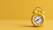 © matpit73 - Yellow vintage alarm clock isolated on a yellow background