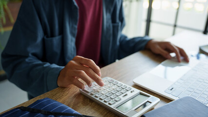 Wall Mural - Business man accountant financial analyst and auditor working and laptop for calculating 