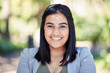 © AzeemudDeen/peopleimages.com - Nature, smile and portrait of businesswoman in park with pride in legal case for career growth. Happy, confident and female environmental lawyer in outdoor forest for land conservation in Brazil.