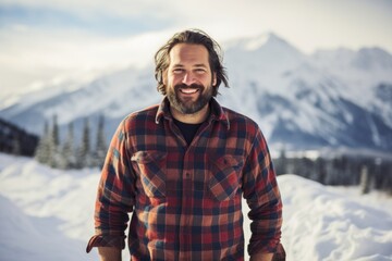 Poster - Portrait of a grinning man in his 40s wearing a comfy flannel shirt in pristine snowy mountain