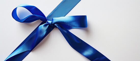 Fototapete - White backdrop with a blue ribbon on a blank card for design with a copy space image