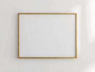 Minimalist gold blank vertical frame for wall art mock up on white wall.