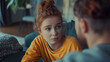 © Natali - A 14 year old girl talks to an adult, view over the shoulder of the adult, the girl has a concerned facial expression