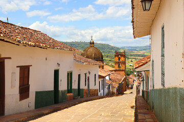 streets of the magical town of barichara, santander colombia, with cathedral