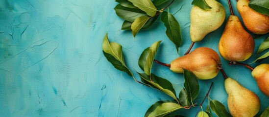 Poster - Fresh pears and leaves on a blue backdrop with copy space image