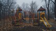 © savittree - Somber scene of an abandoned playground under a gray sky, creating a sense of stillness and nostalgia.