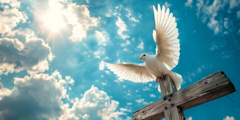 Holy spirit symbol, white dove flying over wooden cross with blue sky background