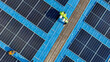 © ultramansk - Worker Technicians are working to construct solar panels system on roof. Installing solar photovoltaic panel system. Men technicians walking on roof structure to check photovoltaic solar modules.