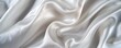 © Viktoriia - White silk fabric flowing creating abstract shapes background