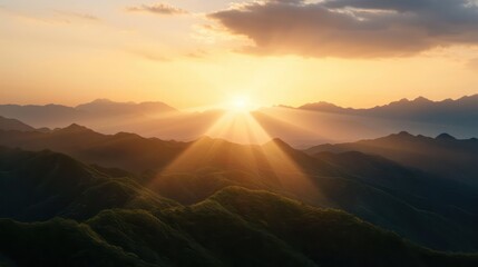 Aufkleber - The sun is shining brightly on the mountains, creating a warm and peaceful atmosphere. The mountains are covered in lush green trees, and the sky is a beautiful shade of orange. The scene is serene
