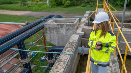 Wall Mural - Environmental engineers work at wastewater treatment plants,Water supply engineering working at Water recycling plant for reuse