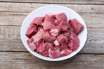 Poster - Beef cubes . Photography of raw cutting meat