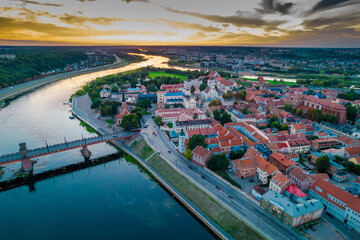 Wall Mural - Kaunas old town, Lithuania. Aerial view of a colorful summer sunset over the city and Nemunas and Neris river confluence