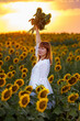 © Олег Мальшаков - Beautiful young girl in a white dress in sunflowers