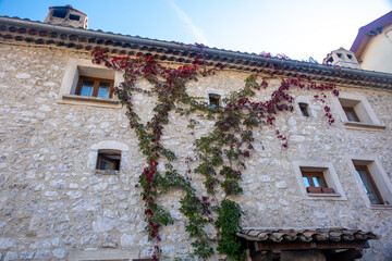 Sticker - classic stone facade of townhouses  in little village in the Southern French Alps late summer