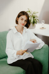 Poster - Woman Reading Documents on Bright Day