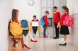 © Pixel-Shot - Little pupils at school hall