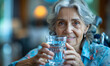 © Bartek - Compassionate Caregiver Assisting Elderly Woman in Wheelchair with Glass of Water at Retirement Home in the Morning to Promote Senior Well-being and Support