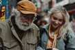 © Milos - An elderly man wearing a cap shares a moment with a young woman as they look at a smartphone together, showing the bridging of generational gaps through technology.