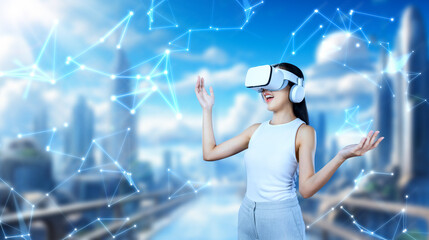 Female stand wear white VR headset and white sleeveless connect metaverse, future technology create cyberspace community. She look around and gesticulate enjoy fantasy building in meta. Hallucination.