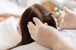 © Home-stock - Beautician injections for healthy hair growth. Mesotherapy of the scalp. Woman undergoing course of spa treatments in the office of beautician