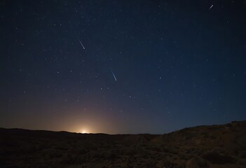 Canvas Print - A meteor shower streaking across the sky above the cratered surface of a moon, with meteors leaving bright trails.