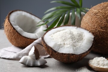 Wall Mural - Organic coconut flour, fresh fruits and leaf on light grey table, closeup