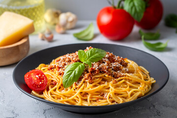 Wall Mural - Pasta spaghetti bolognese with minced beef sauce, tomatoes, parmesan cheese and fresh basil in a plate