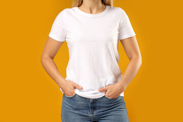 Wall Mural - A young woman in a white T-shirt