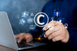 © jittawit.21 - Businessman use laptop with virtual copyright symbol for author rights and patented intellectual property.