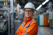 © movinglines.studio - Confident Female Engineer in Safety Gear Posing in an Industrial Factory Setting