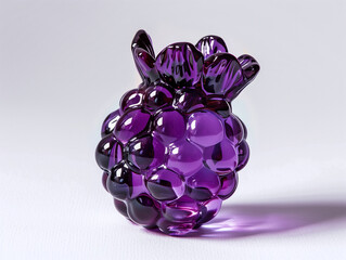 Wall Mural - purple glass figurine of a bunch of grapes on a white surface