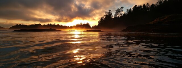 Wall Mural -  A tranquil scene featuring a body of water surrounded by trees in the foreground, a sunset reflected in the water's surface, and clouds painted across the sky