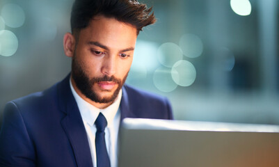 Poster - Thinking, serious and man in night, laptop and test of software for cybersecurity, programmer and bokeh. Late, overtime and employee for coding of website, IT and information technology in dark