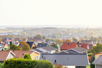 Poster - Cityscape view at rooftops in a residential area a autumn day