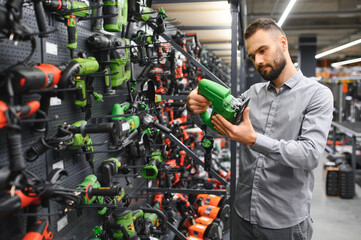 Wall Mural - male customer in a power tool store